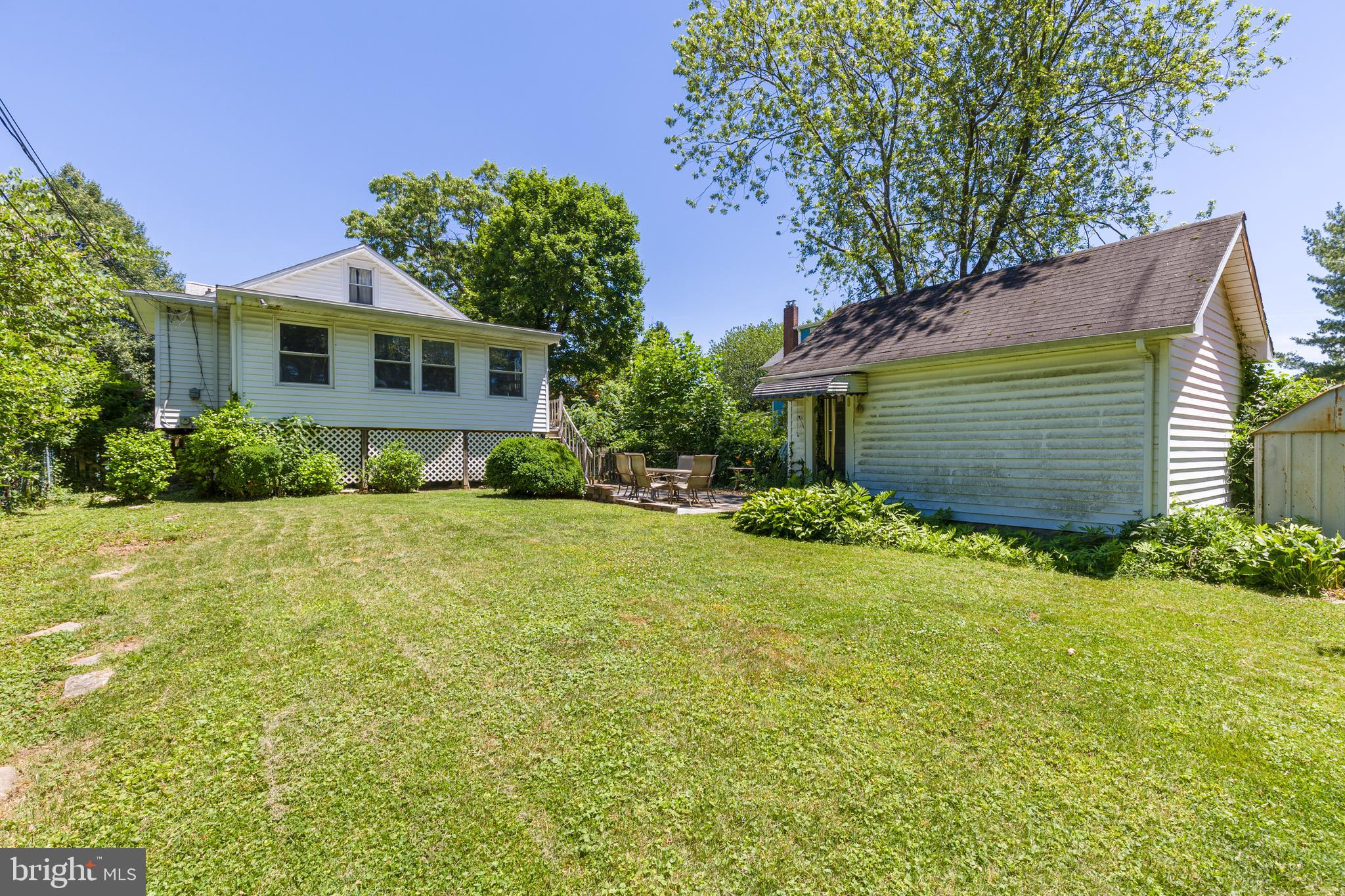 6426 Sherwood Road Baltimore, MD 21239 - Photo 42 of 43 a front view of a house with a garden