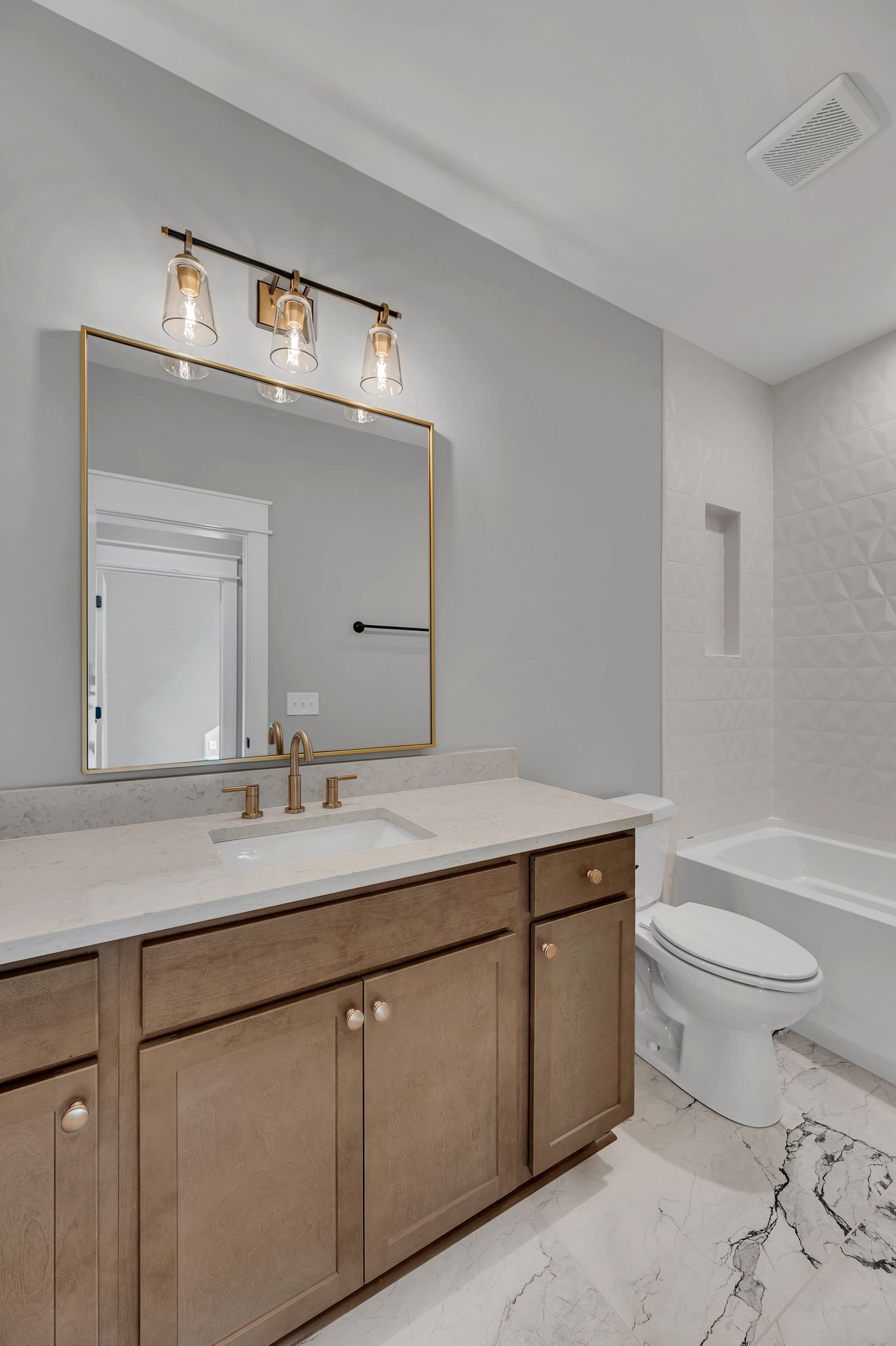 520 North Maple Street, Unit 2 Murfreesboro, TN 37130 - Photo 19 of 34 a bathroom with a granite countertop sink a toilet and a mirror