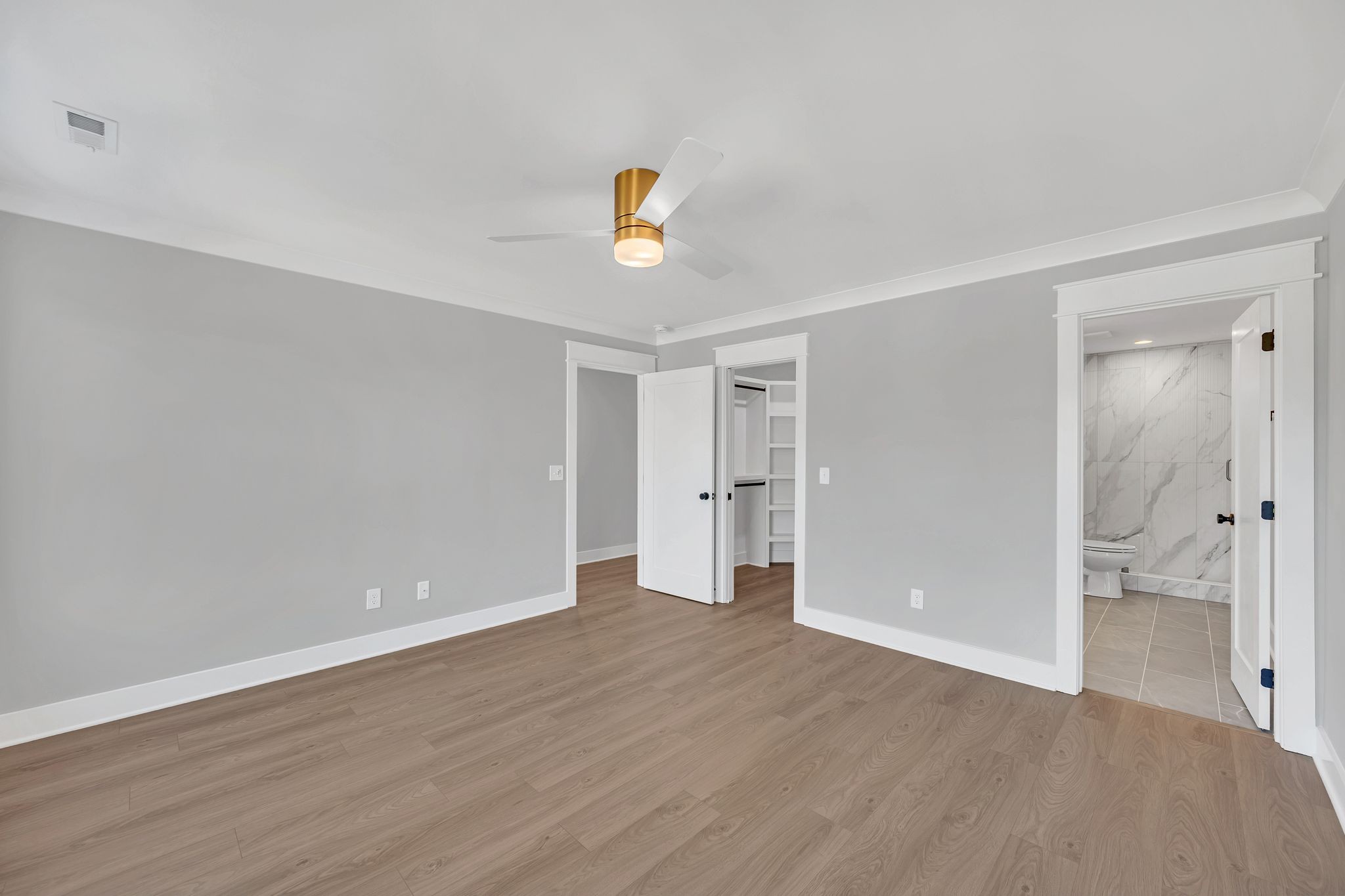 520 North Maple Street, Unit 2 Murfreesboro, TN 37130 - Photo 27 of 34 a view of an empty room with wooden floor and a ceiling fan