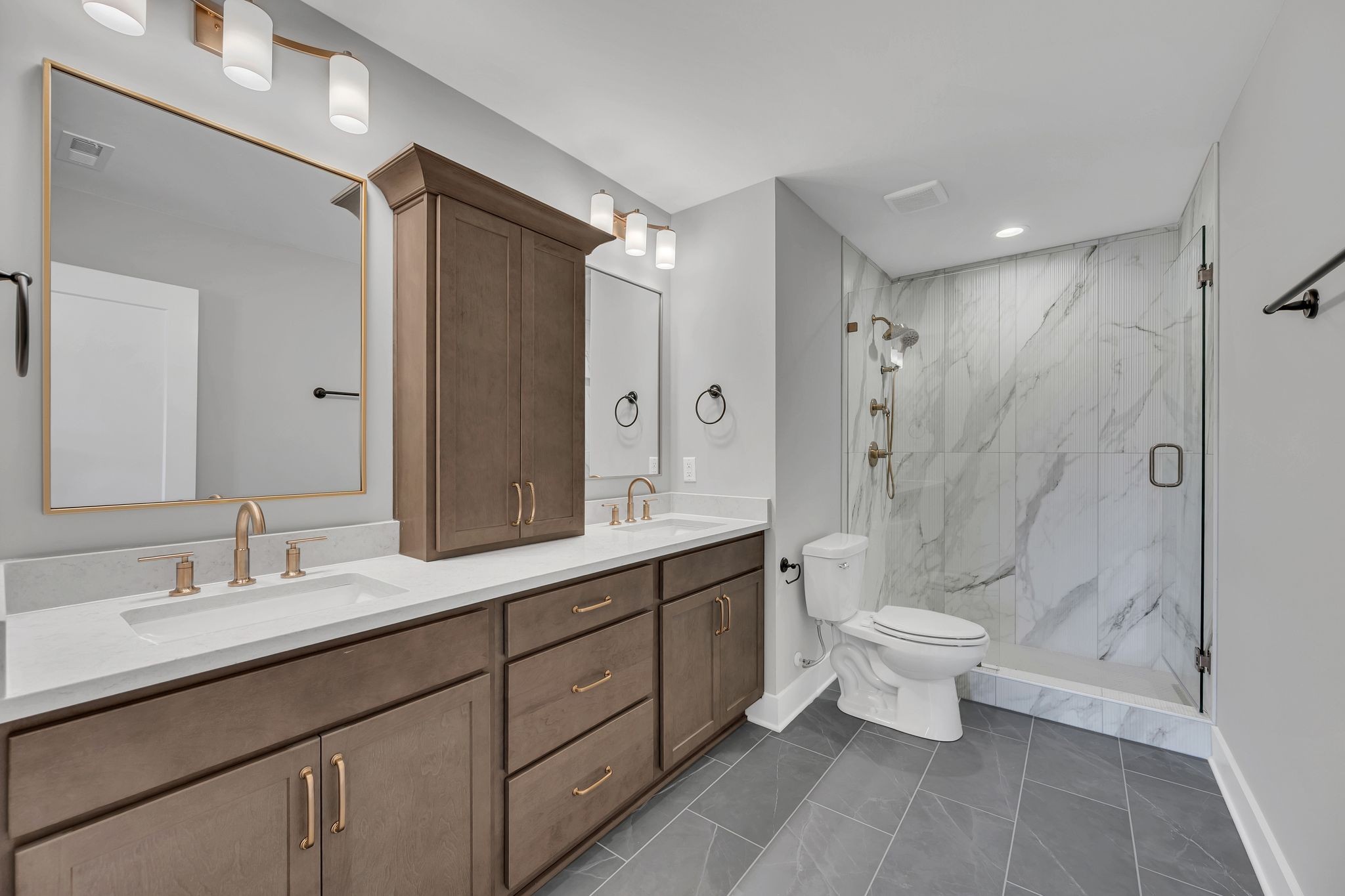 520 North Maple Street, Unit 2 Murfreesboro, TN 37130 - Photo 28 of 34 a bathroom with a double vanity sink toilet and shower