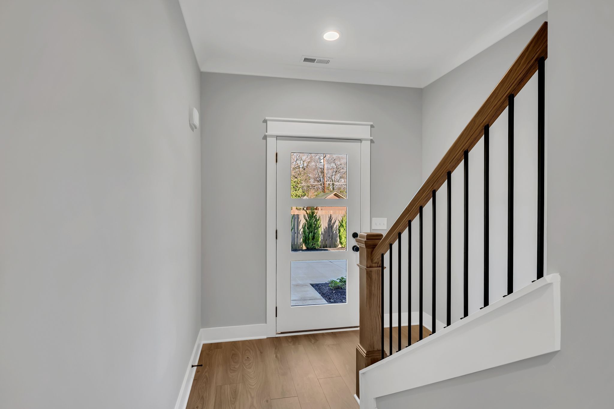 520 North Maple Street, Unit 2 Murfreesboro, TN 37130 - Photo 7 of 34 a view of a hallway with wooden floor and stairs