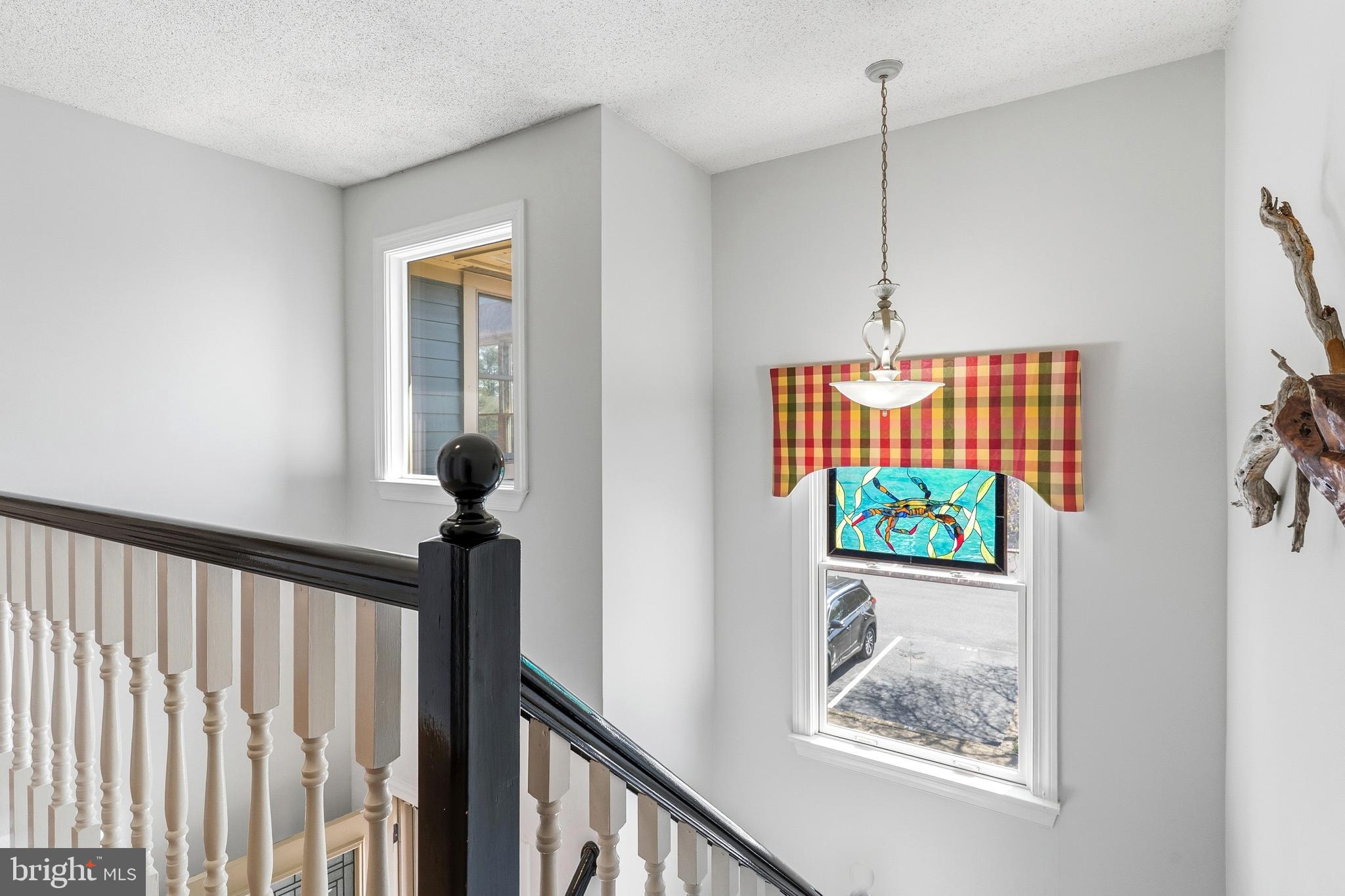 754 Bellefield Road, Unit 103 Solomons, MD 20629 - Photo 20 of 62 a view of a hallway with a window