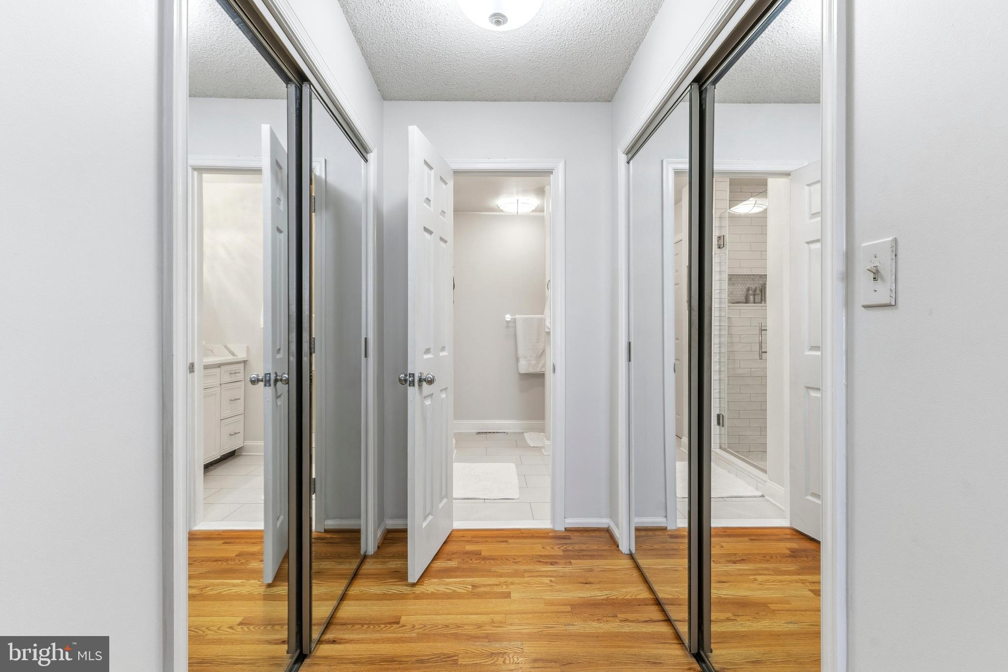 754 Bellefield Road, Unit 103 Solomons, MD 20629 - Photo 23 of 62 a view of a bathroom with a glass door