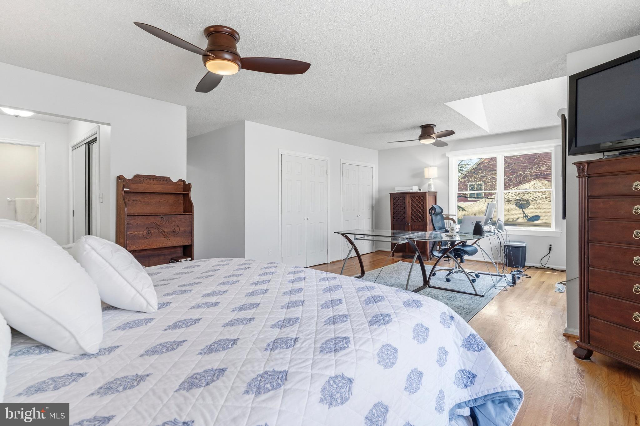 754 Bellefield Road, Unit 103 Solomons, MD 20629 - Photo 29 of 62 a bedroom with furniture and a flat screen tv