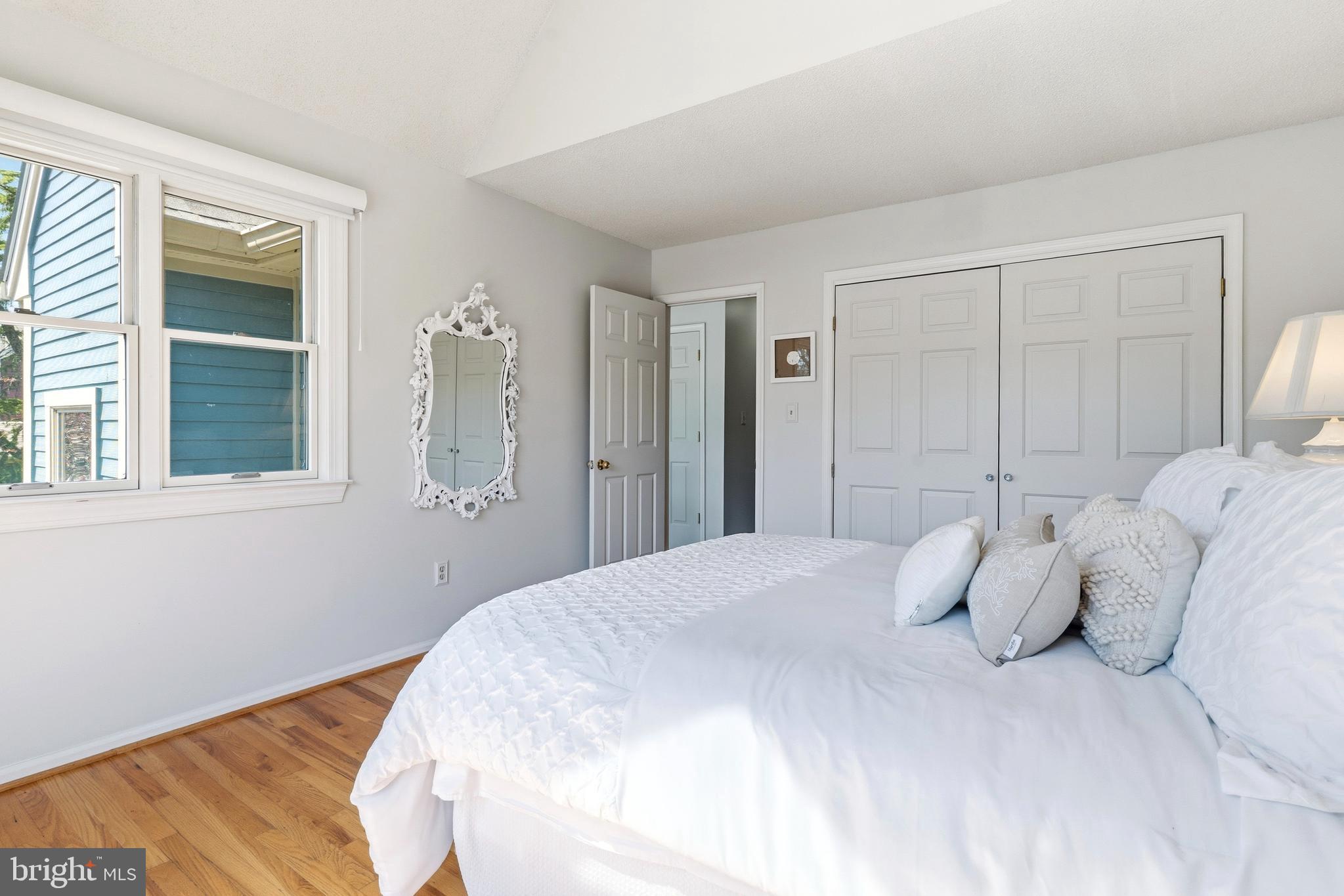 754 Bellefield Road, Unit 103 Solomons, MD 20629 - Photo 31 of 62 a bedroom with a bed and a window