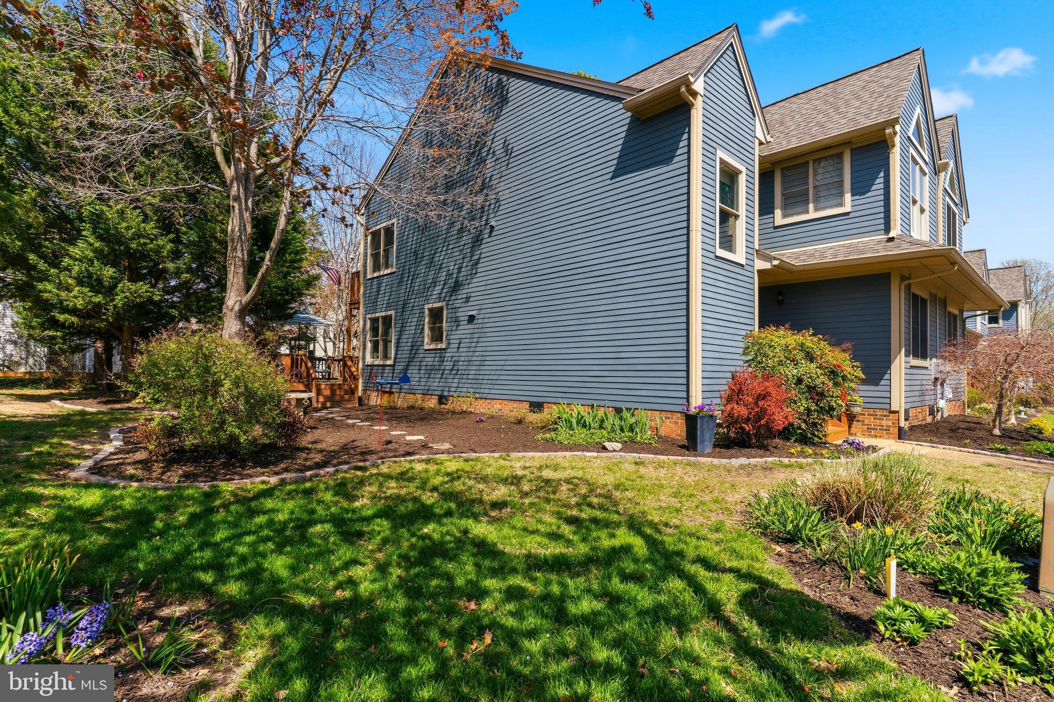 754 Bellefield Road, Unit 103 Solomons, MD 20629 - Photo 35 of 62 a view of a house with a yard