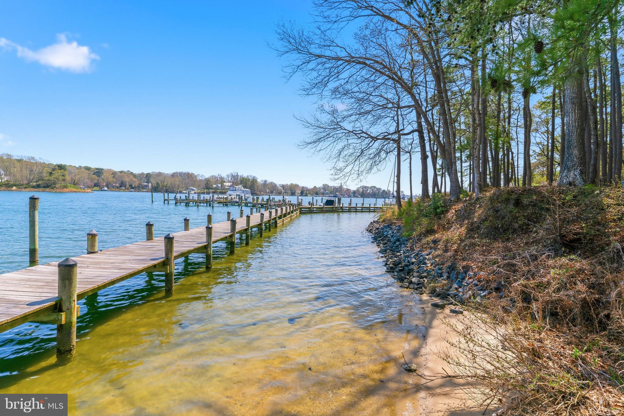 754 Bellefield Road, Unit 103 Solomons, MD 20629 - Photo 42 of 62 a view of a lake with houses in the back