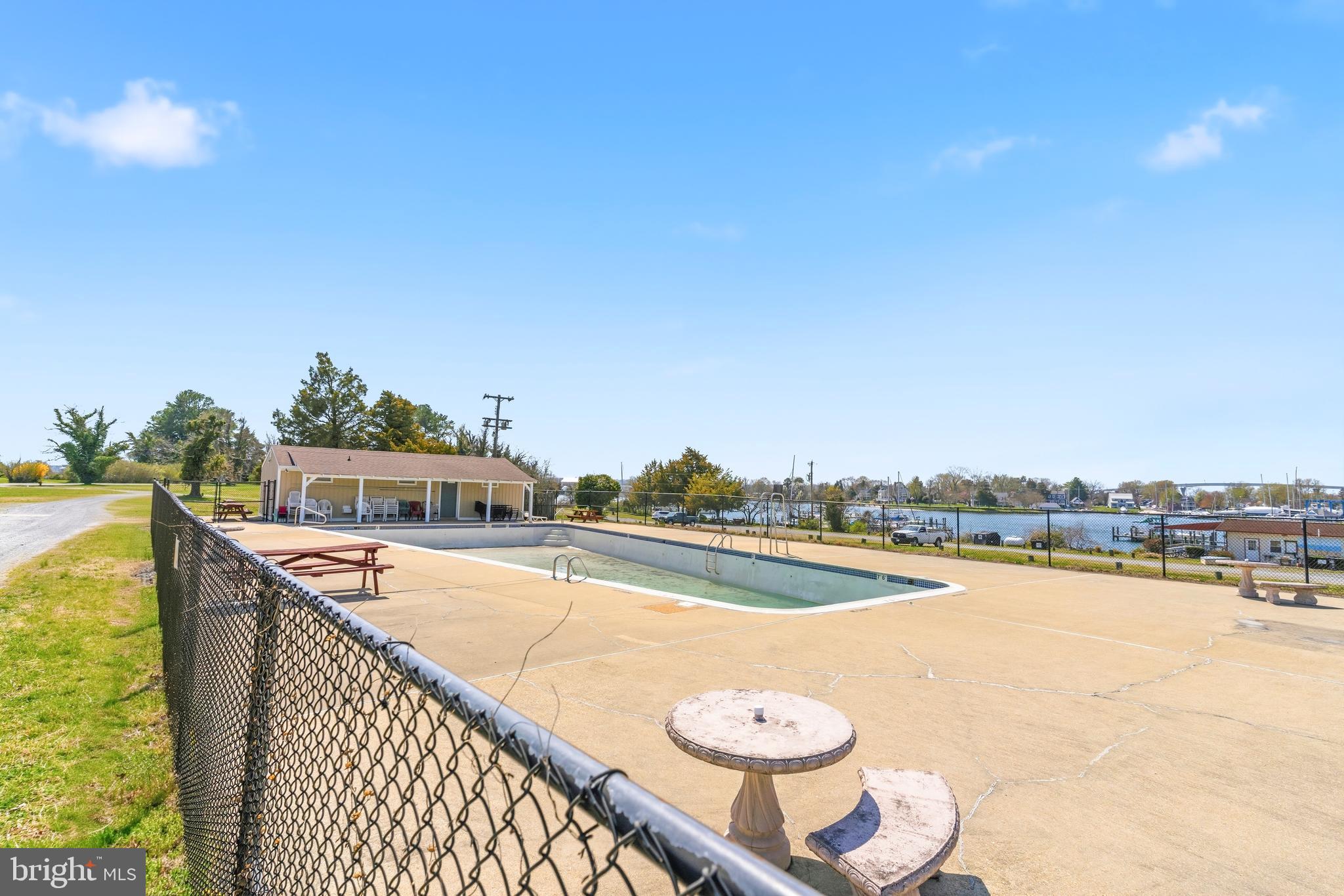 754 Bellefield Road, Unit 103 Solomons, MD 20629 - Photo 48 of 62 a view of a swimming pool and an ocean