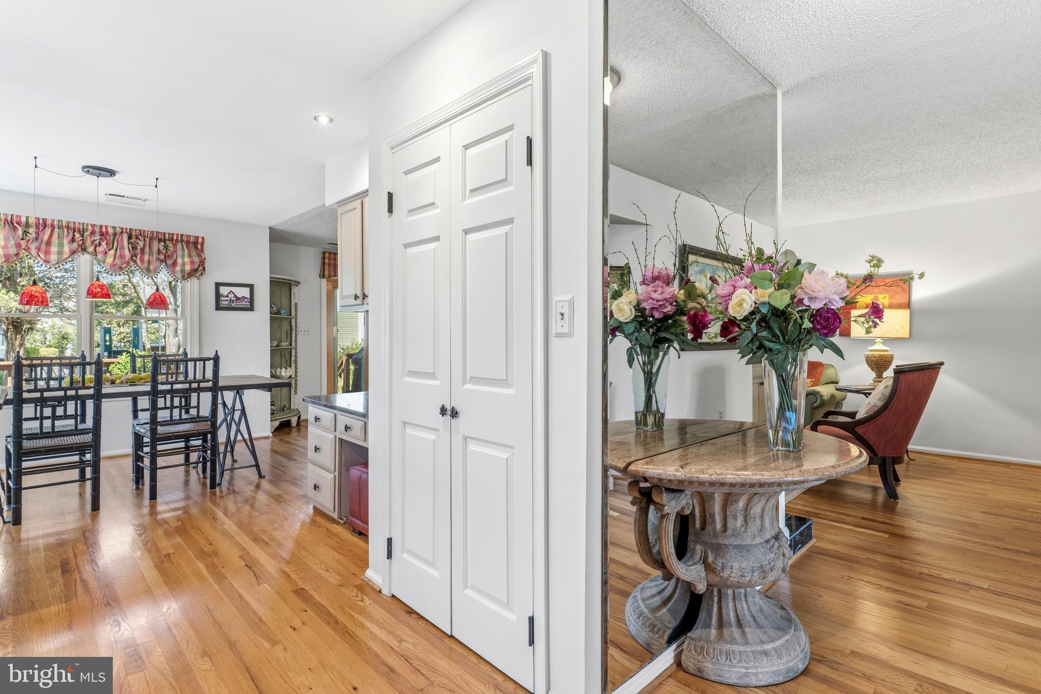 754 Bellefield Road, Unit 103 Solomons, MD 20629 - Photo 5 of 62 a view of a dining room with furniture and wooden floor