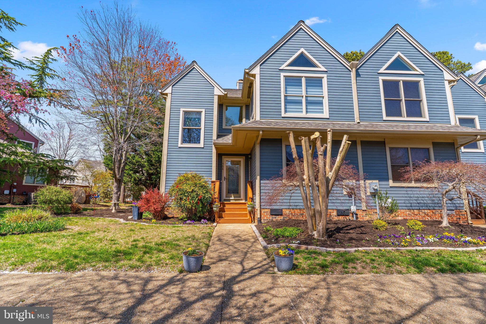 754 Bellefield Road, Unit 103 Solomons, MD 20629 - Photo 61 of 62 a front view of a house with garden