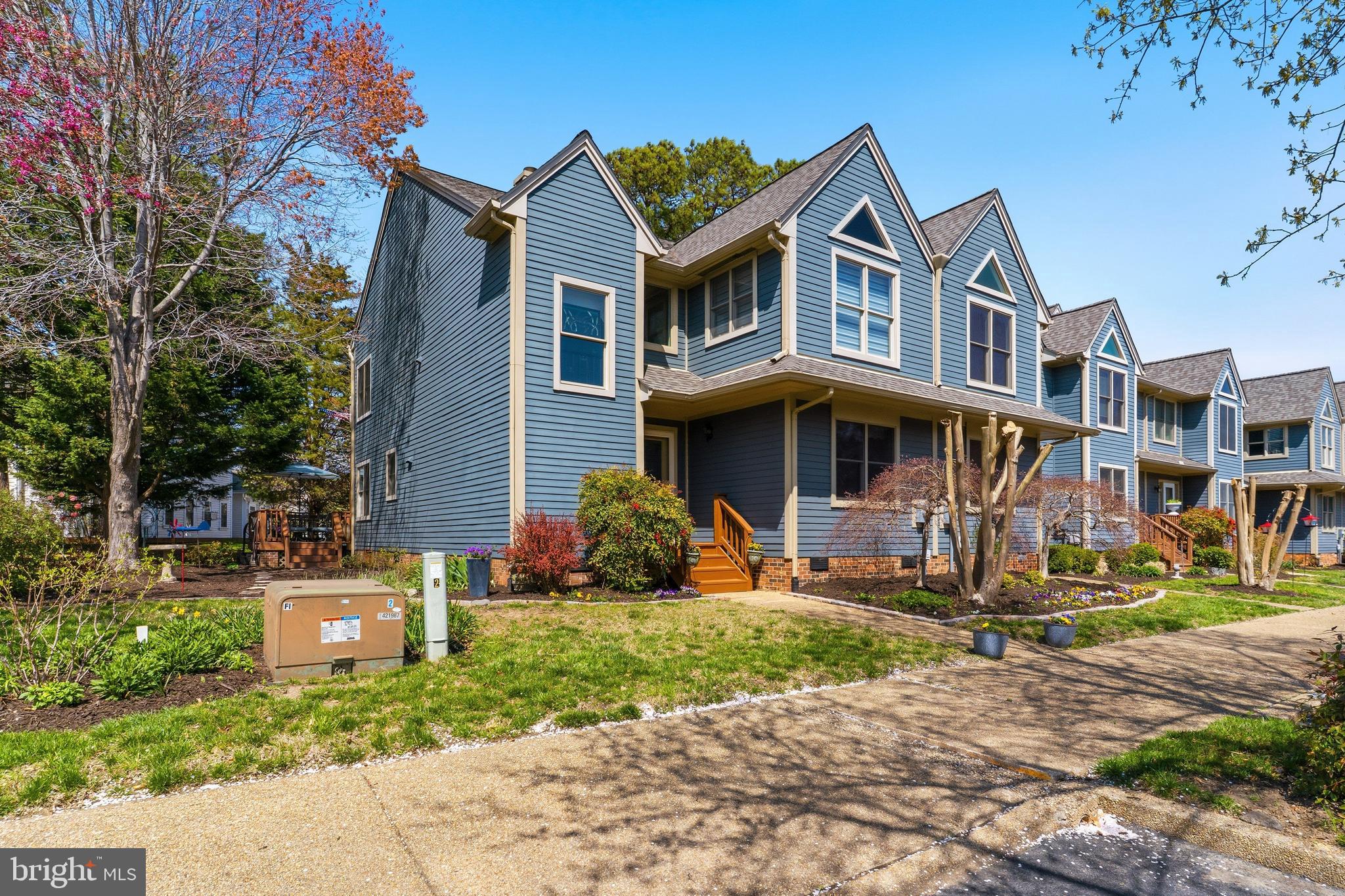 754 Bellefield Road, Unit 103 Solomons, MD 20629 - Photo 62 of 62 a front view of a house with a yard
