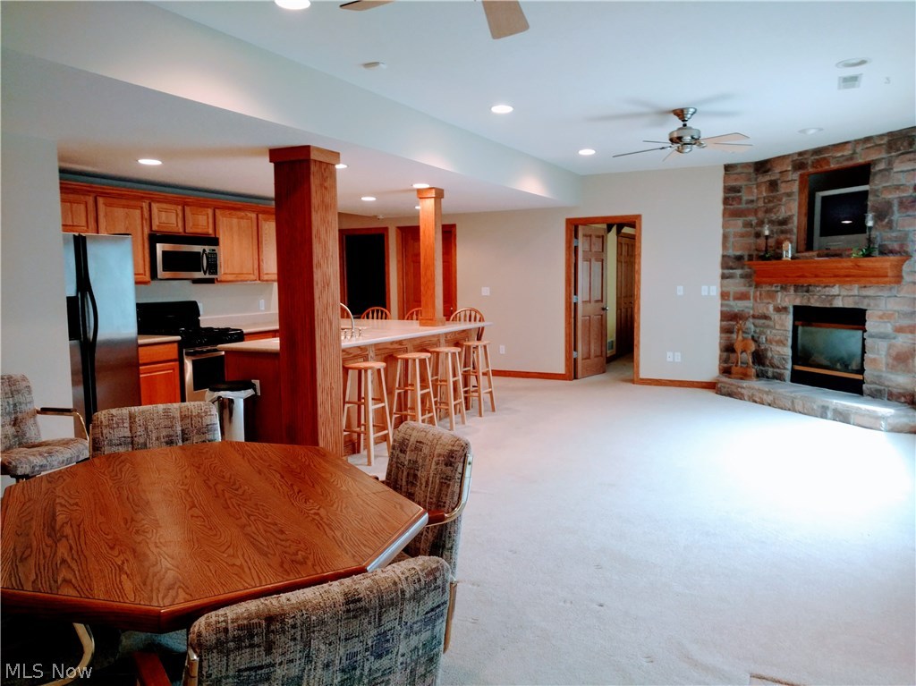 5136 Burnett Road Kent, OH 44240 - Photo 21 of 28 A different view of the lower level kitchen and family room...amazing space...just to the right is a walk out patio to the back yard.