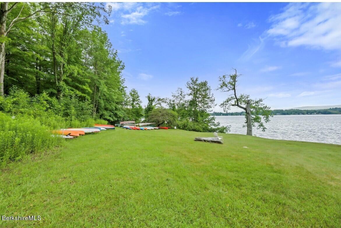 1136 Barker Road, Unit 48 Pittsfield, MA 01201 - Photo 12 of 53 a view of a golf course with a lake