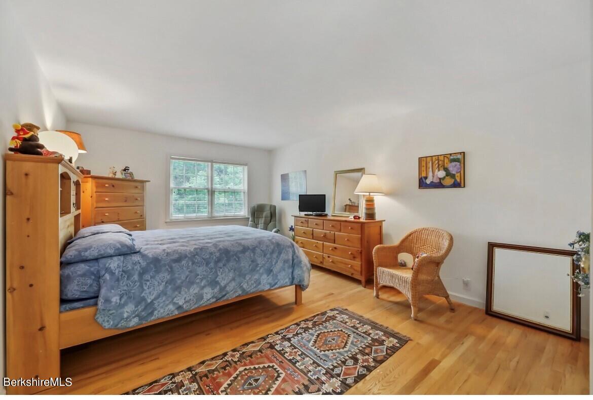 1136 Barker Road, Unit 48 Pittsfield, MA 01201 - Photo 15 of 53 a bedroom with furniture and a window