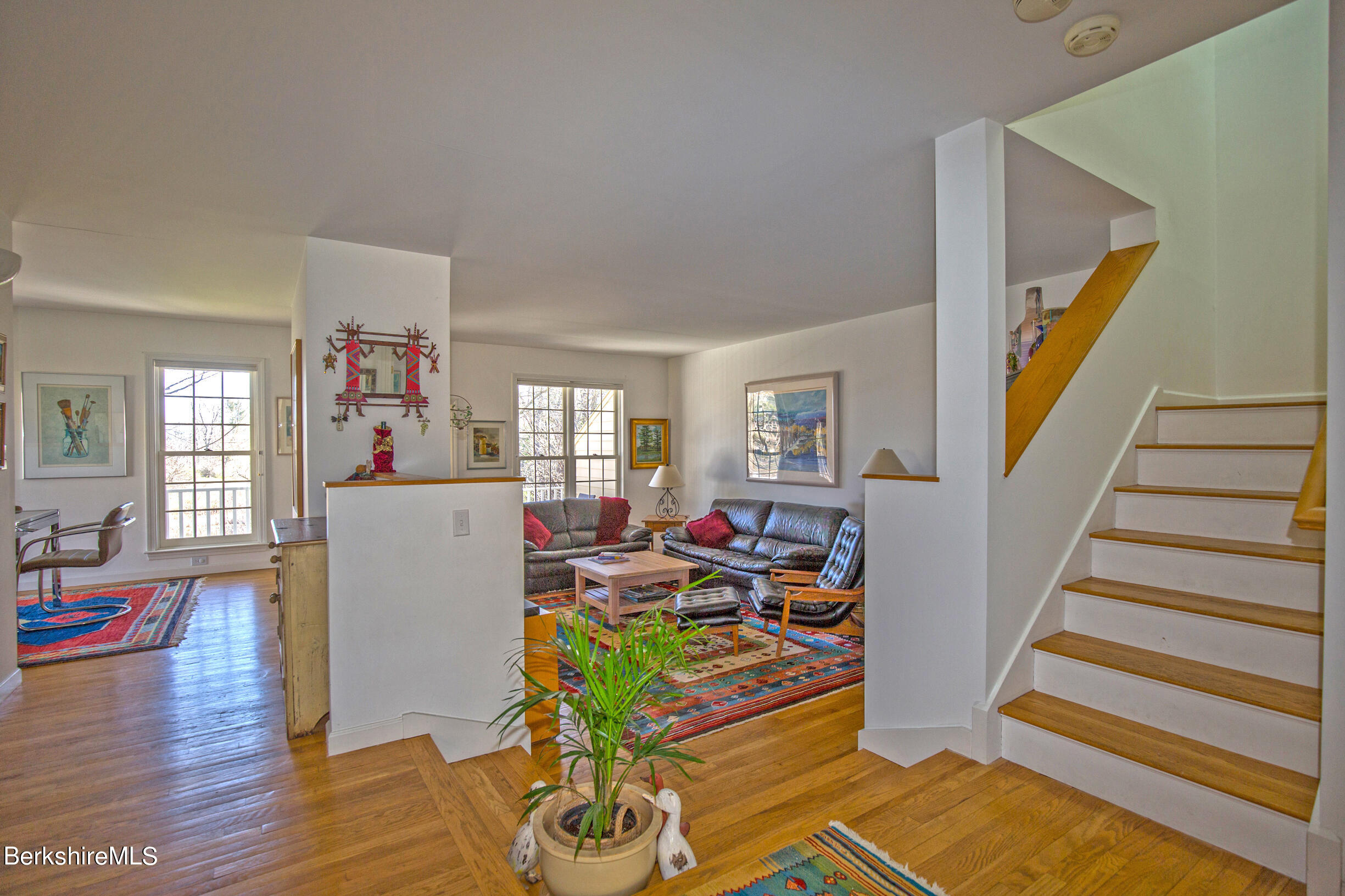 1136 Barker Road, Unit 48 Pittsfield, MA 01201 - Photo 19 of 53 a living room with furniture a fireplace and wooden floor
