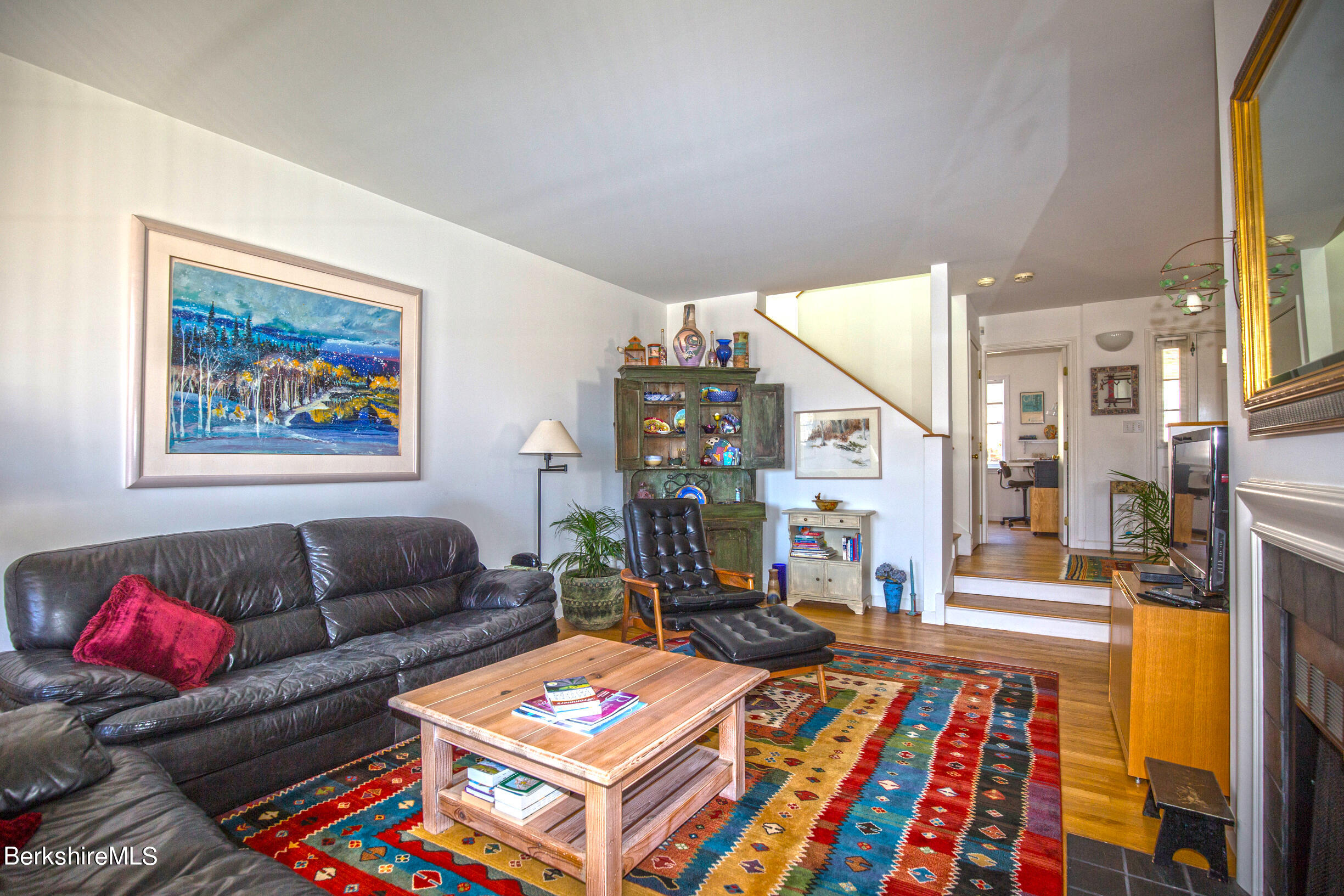 1136 Barker Road, Unit 48 Pittsfield, MA 01201 - Photo 21 of 53 a living room with furniture a rug and a floor to ceiling window