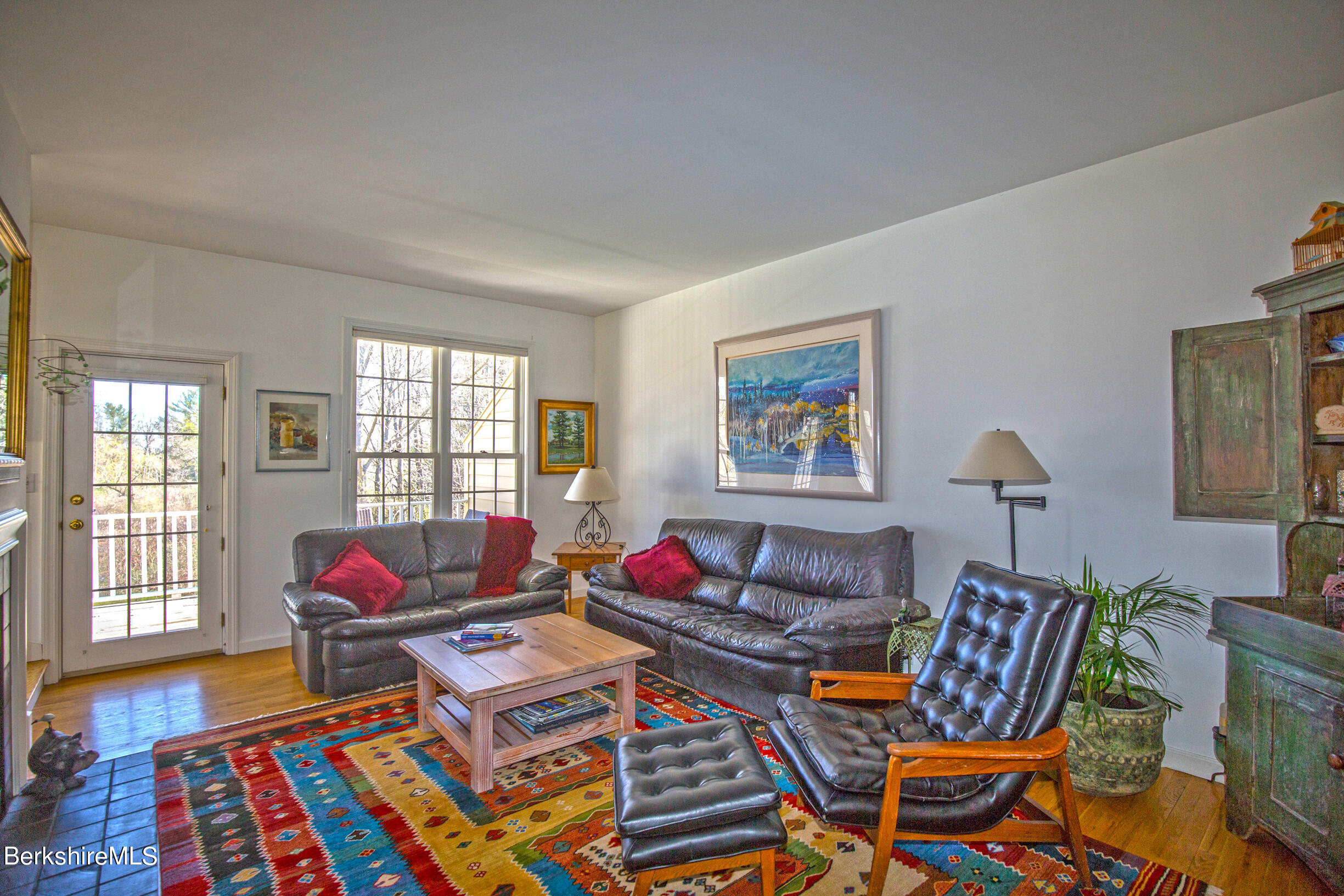 1136 Barker Road, Unit 48 Pittsfield, MA 01201 - Photo 22 of 53 a living room with furniture and a floor to ceiling window
