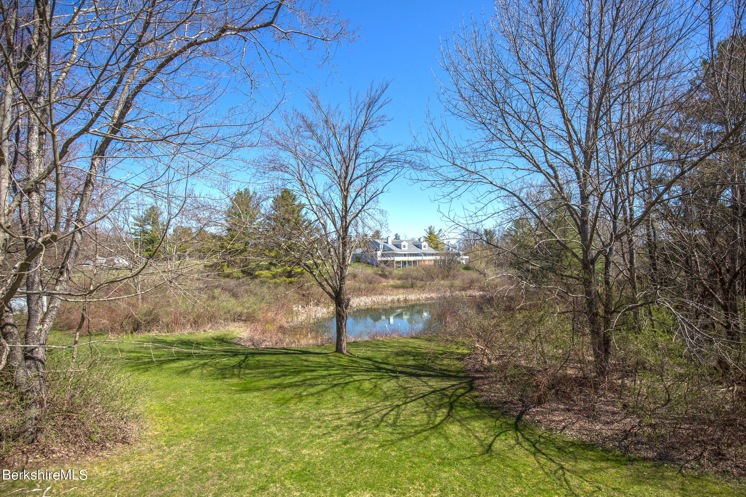 1136 Barker Road, Unit 48 Pittsfield, MA 01201 - Photo 42 of 53 a backyard of a house with lots of green space