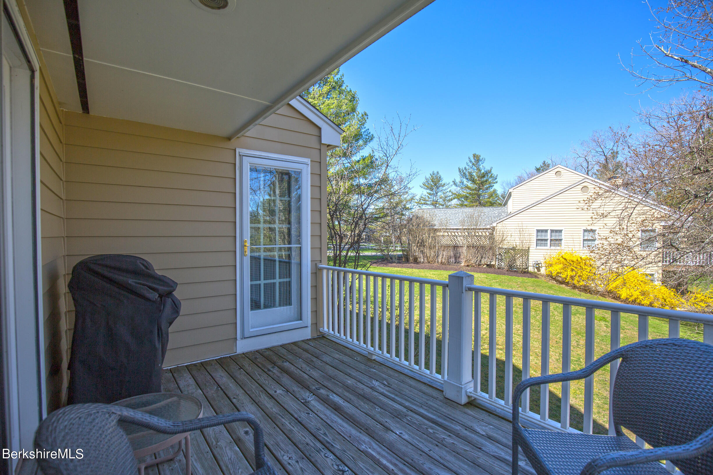 1136 Barker Road, Unit 48 Pittsfield, MA 01201 - Photo 44 of 53 a view of a balcony with wooden floor