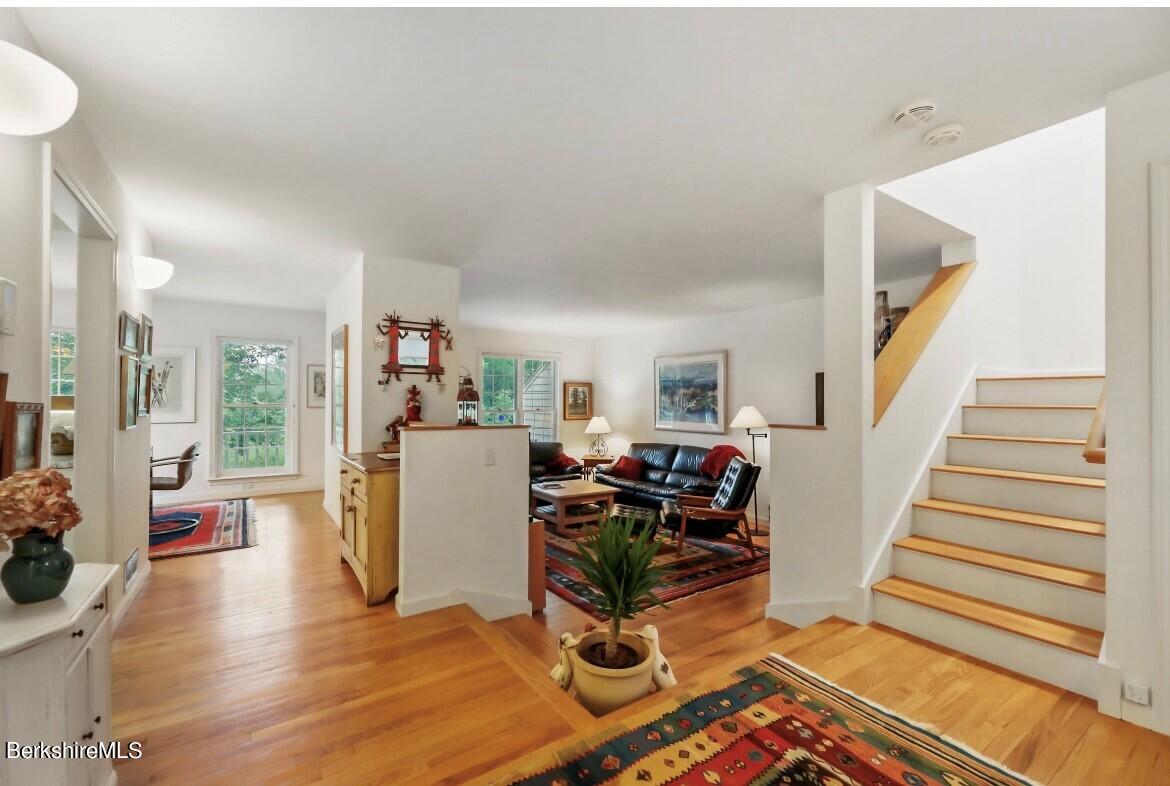 1136 Barker Road, Unit 48 Pittsfield, MA 01201 - Photo 5 of 53 a view of living room filled with furniture and wooden floor