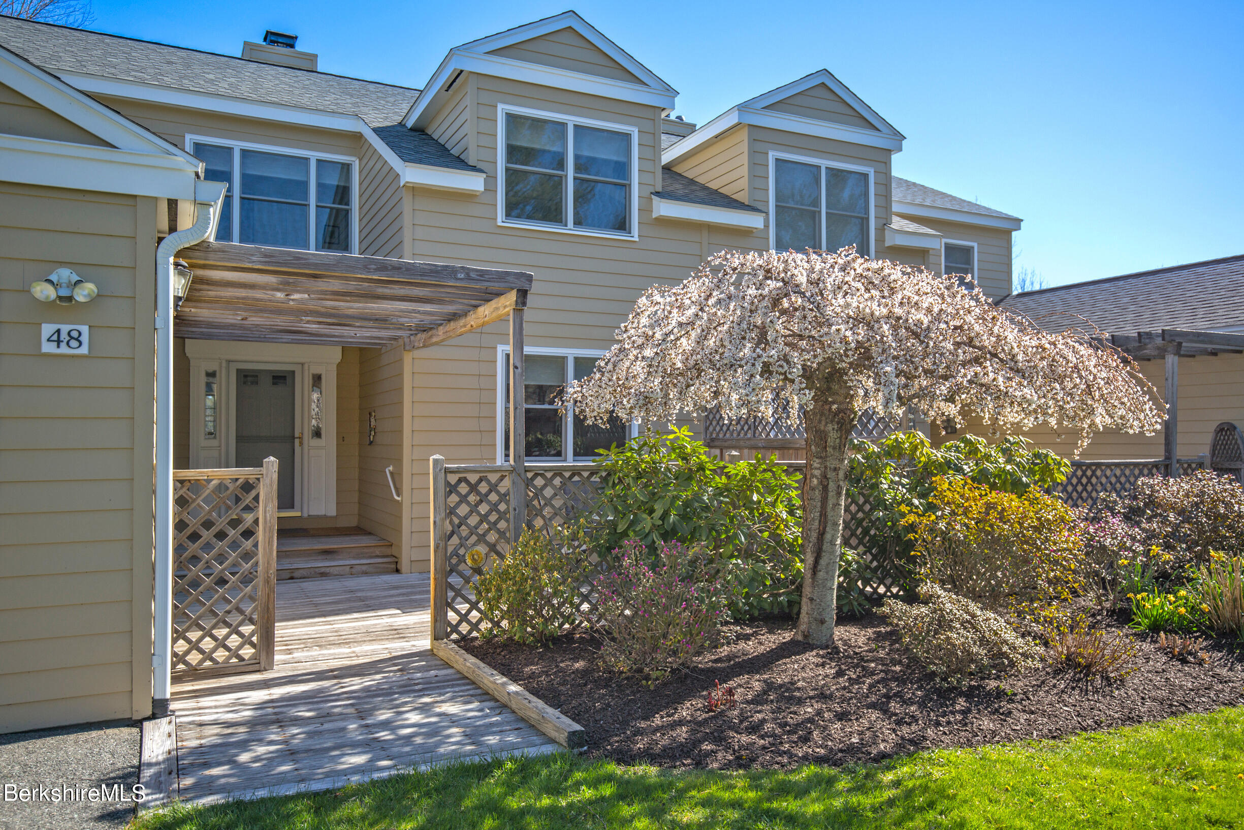 1136 Barker Road, Unit 48 Pittsfield, MA 01201 - Photo 53 of 53 a front view of a house with garden
