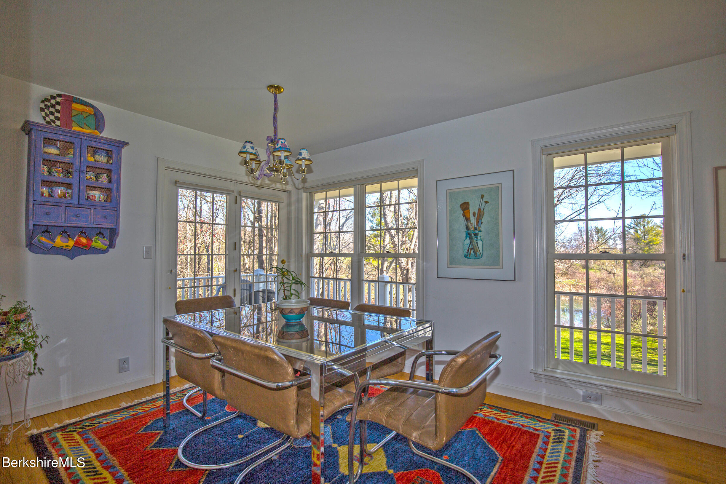 1136 Barker Road, Unit 48 Pittsfield, MA 01201 - Photo 9 of 53 a living room with furniture and a chandelier