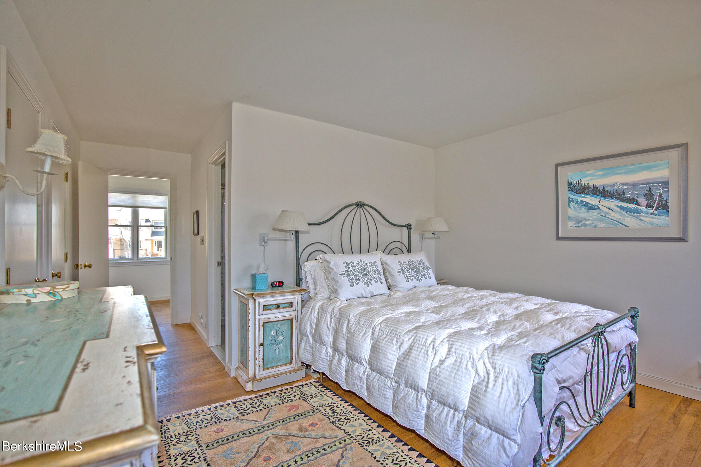 1136 Barker Road, Unit 48 Pittsfield, MA 01201 - Photo 10 of 53 a bedroom with a bed rug and a mirror
