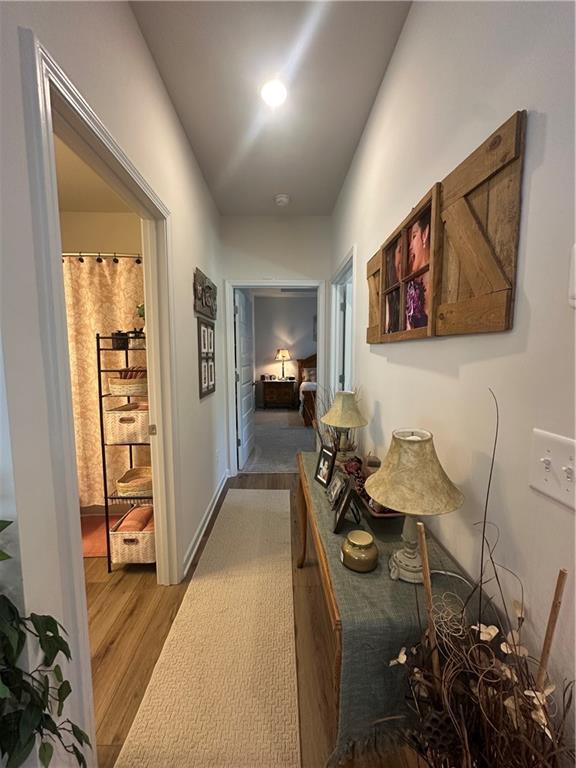 53 Bennett Way Rome, GA 30161 - Photo 40 of 42 a hall way with furniture a rug and a window