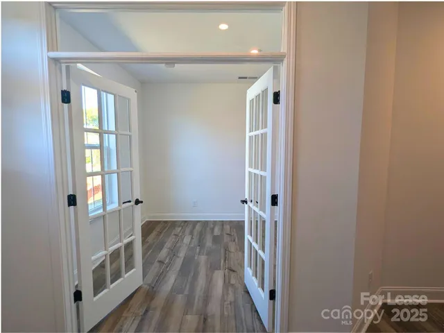 a bathroom with a sink a toilet a mirror and shower