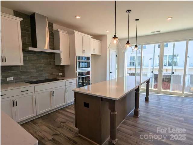 a kitchen with sink and microwave