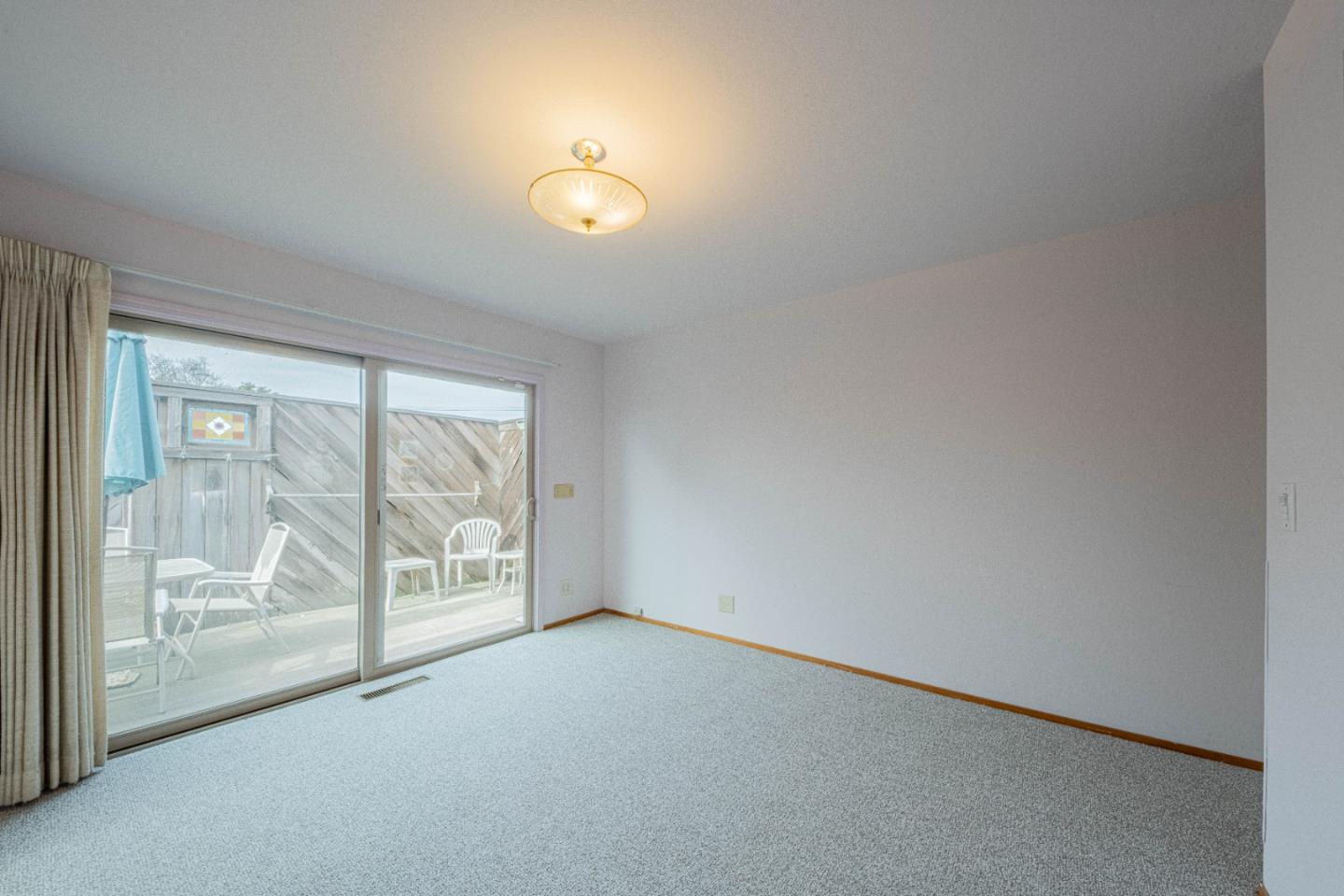 24 St Francis Way Salinas, CA 93906 - Photo 19 of 25 an empty room with wooden floor and windows