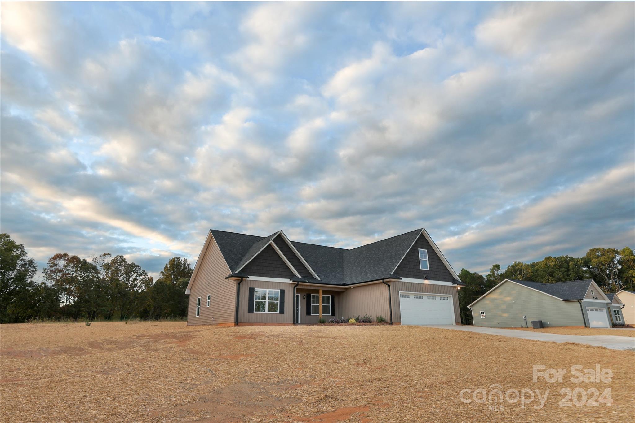 8631 Freeze Road Kannapolis, NC 28081 - Photo 6 of 29 a front view of a house with a yard