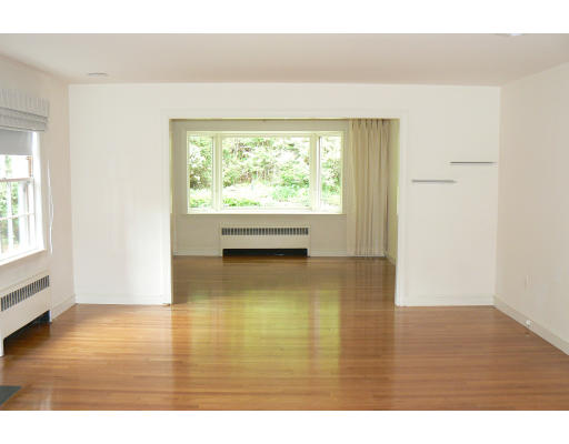 137 Annawan Road Newton, MA 02468 - Photo 3 of 13 a view of an empty room and wooden floor