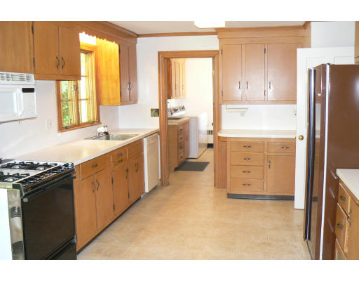 137 Annawan Road Newton, MA 02468 - Photo 5 of 13 a kitchen with a stove a sink and a refrigerator