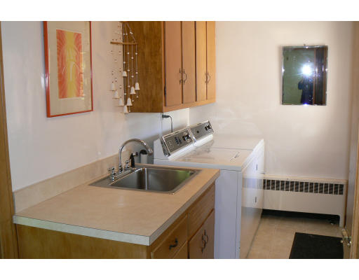137 Annawan Road Newton, MA 02468 - Photo 6 of 13 a kitchen with a sink and cabinets