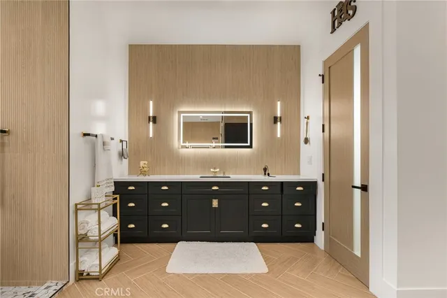 a kitchen with a sink appliances and cabinets