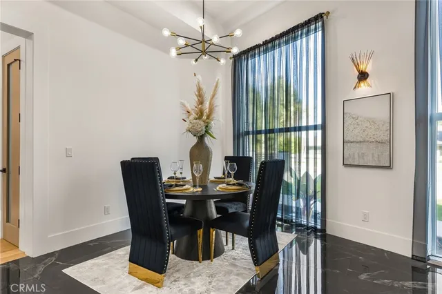 a kitchen with kitchen island granite countertop a sink stainless steel appliances and cabinets