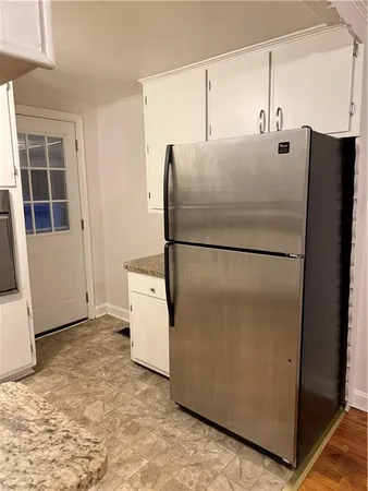a refrigerator freezer sitting in a kitchen