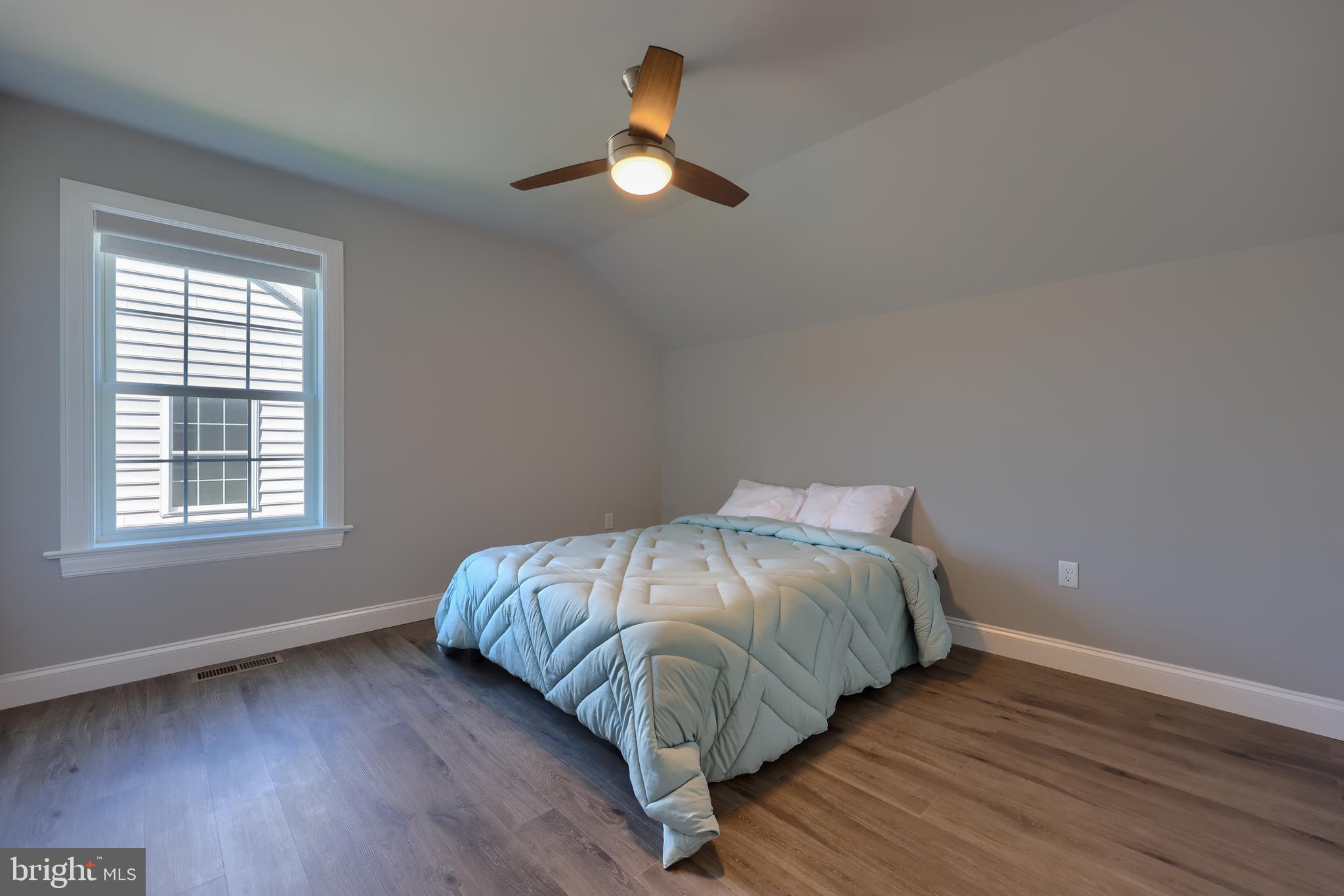 208 Buckton Drive Lititz, PA 17543 - Photo 20 of 25 a bed sitting in a bedroom next to a window