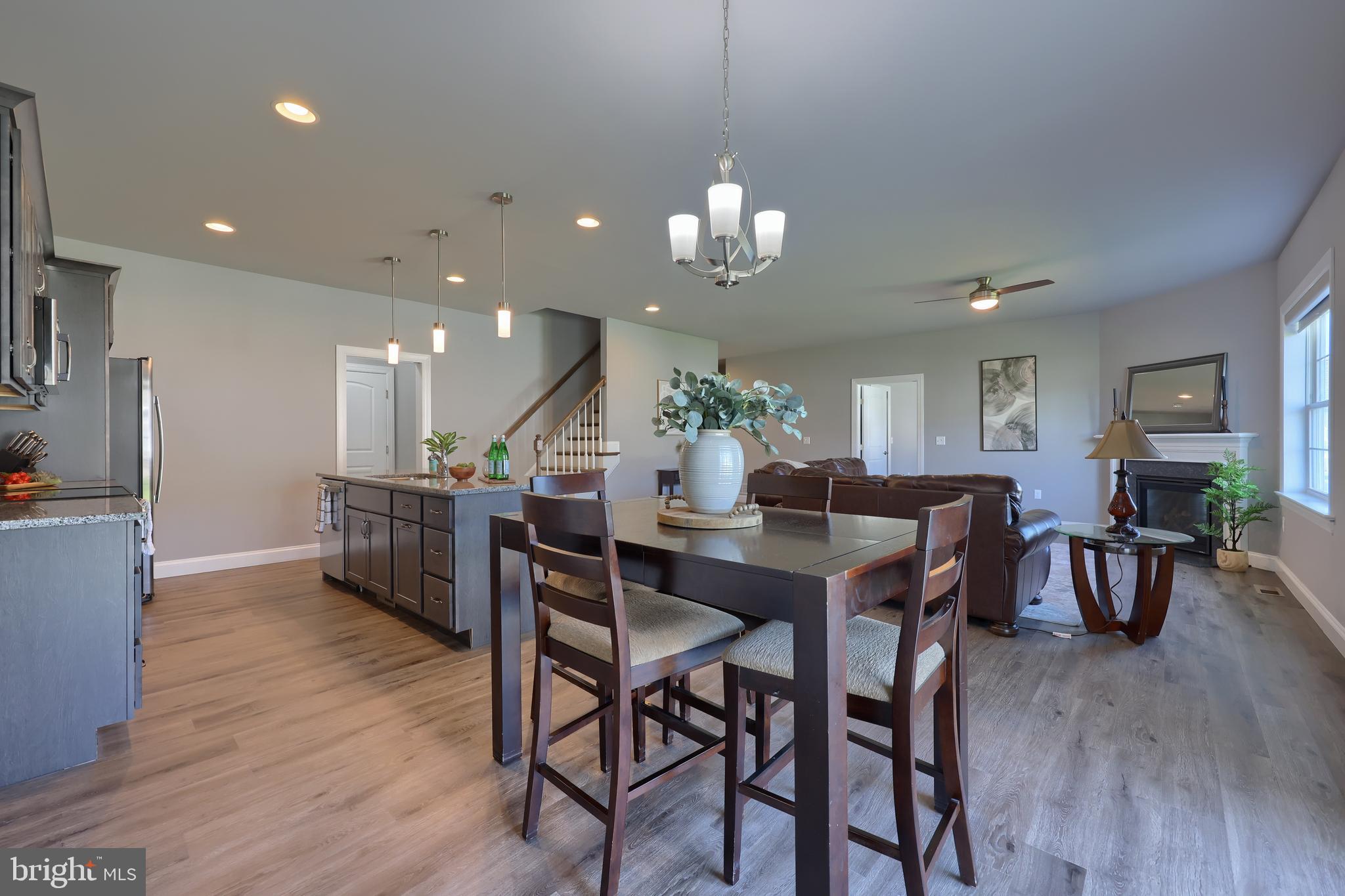 208 Buckton Drive Lititz, PA 17543 - Photo 5 of 25 a view of a dining area with furniture and wooden floor