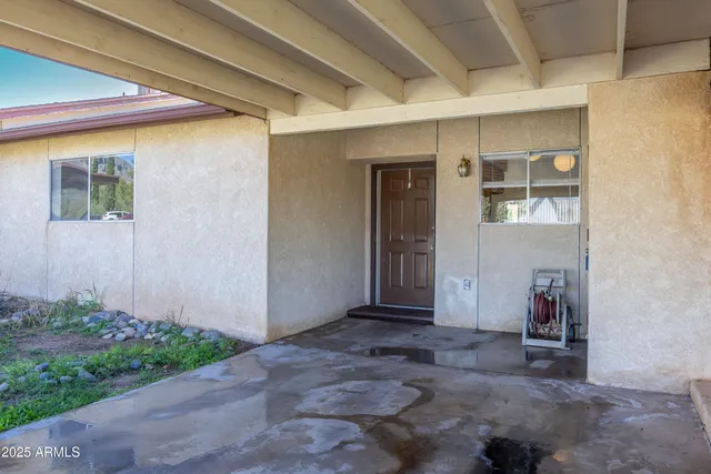 a kitchen with stainless steel appliances granite countertop a stove a sink dishwasher and a refrigerator