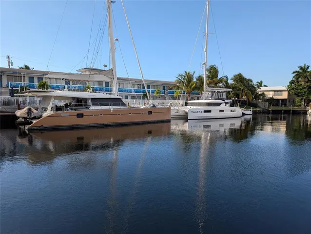 a view of a lake with boats and trees in the background