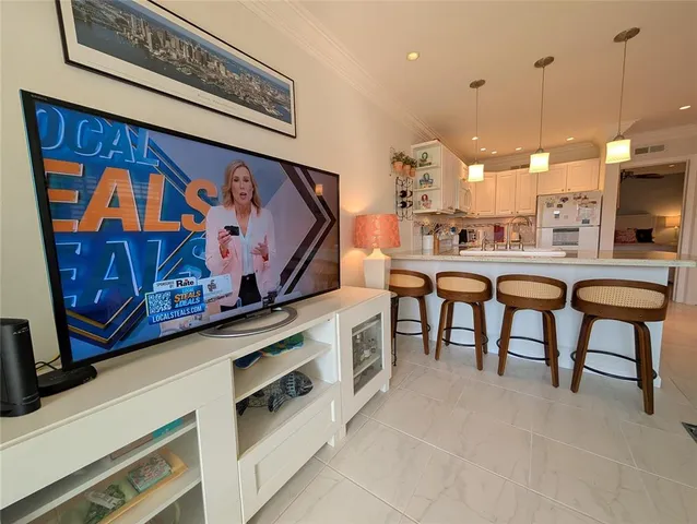 a view of a kitchen with furniture and a window
