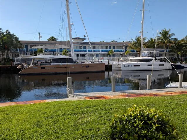 a view of a swimming pool with a yard