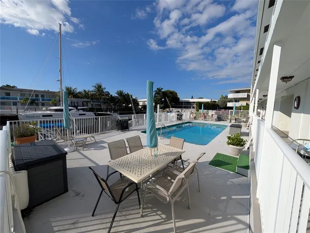 a view of a terrace with furniture and stove