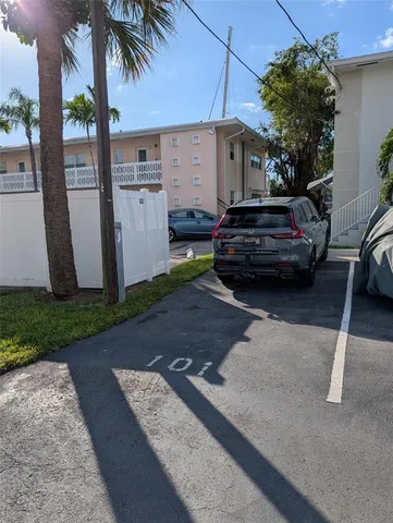 a view of a car parked in front of a house