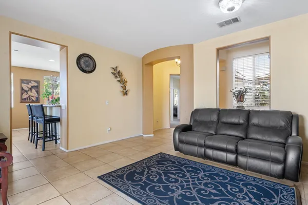 a living room with furniture and a rug