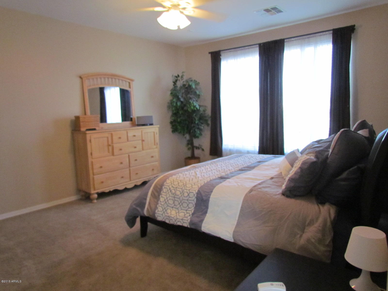4720 East Timberline Road Gilbert, AZ 85297 - Photo 13 of 39 a bedroom with a bed and a dresser