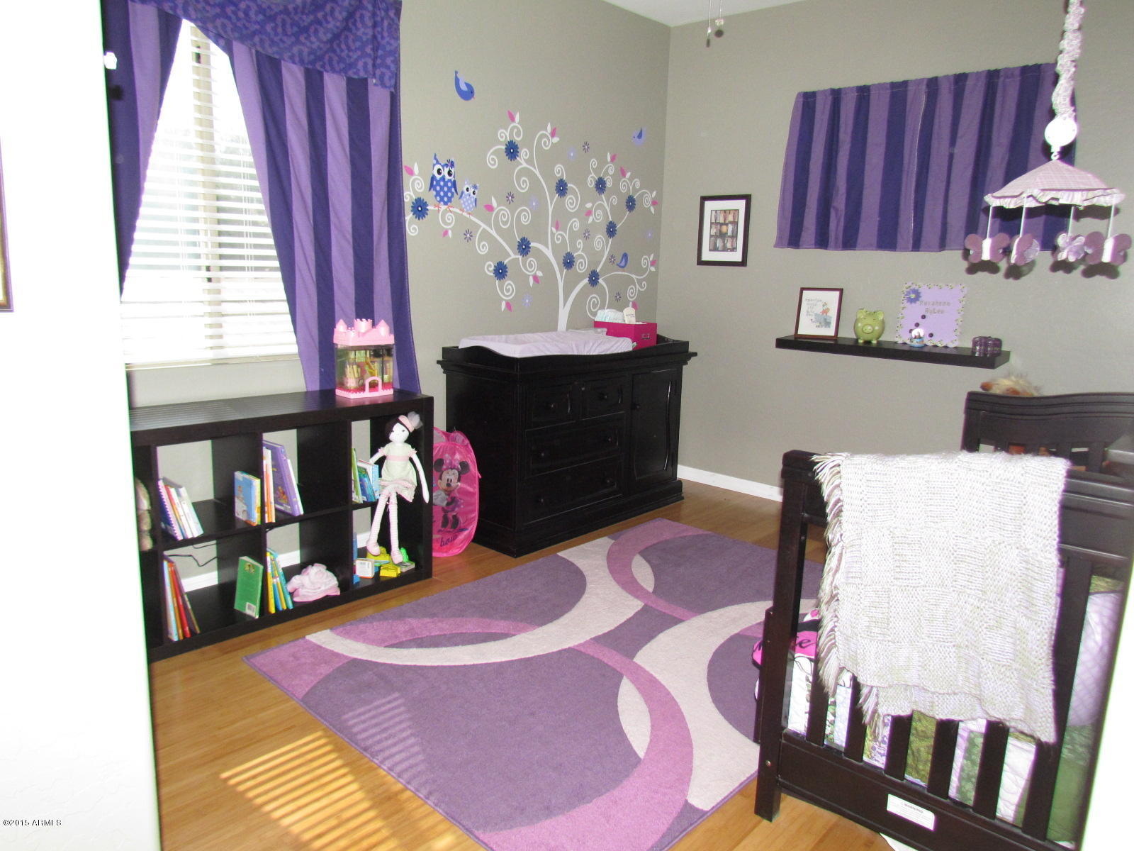 4720 East Timberline Road Gilbert, AZ 85297 - Photo 20 of 39 a bed room with a bed and a book shelf