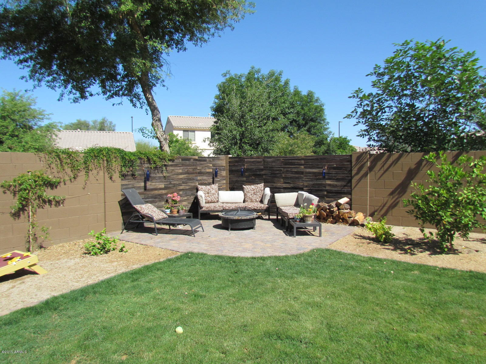 4720 East Timberline Road Gilbert, AZ 85297 - Photo 23 of 39 a view of a backyard with sitting area and slide